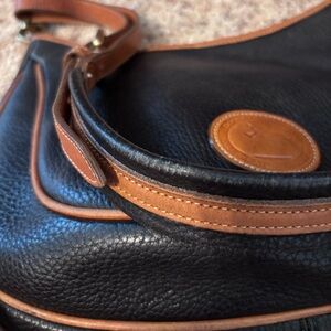 Dooney and Bourke black Leather Shoulder Bag with Tan Trim